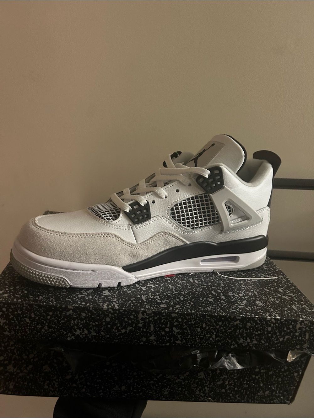 Jordan Retro 4 Sneakers in White and Black
